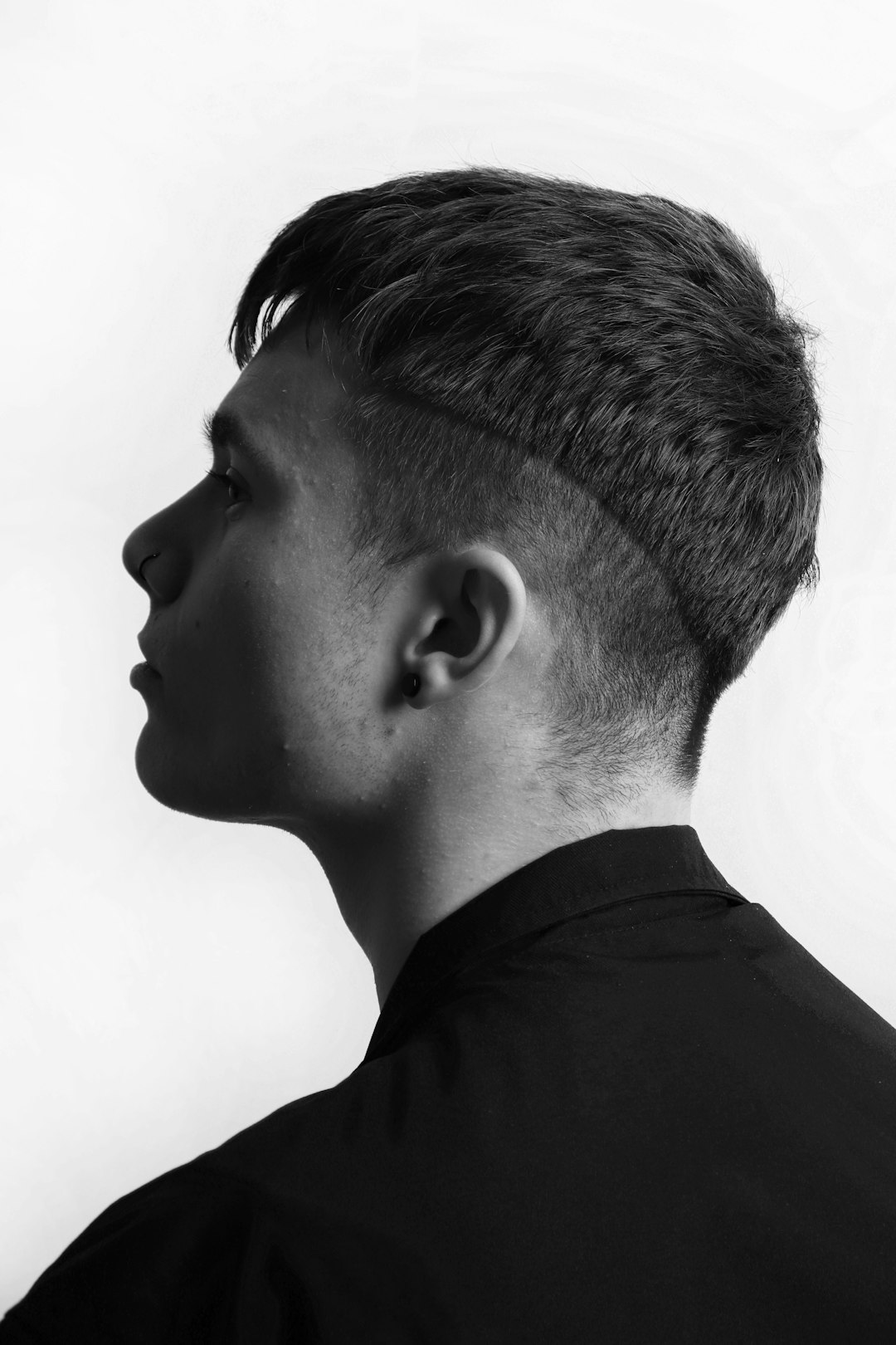 a-black-and-white-photo-of-a-young-man-ymaaunbhhtw